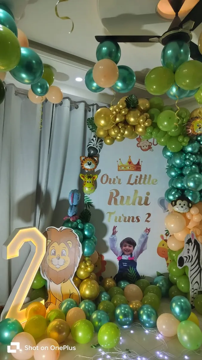 Second birthday gold and green balloon decoration, Gurugram