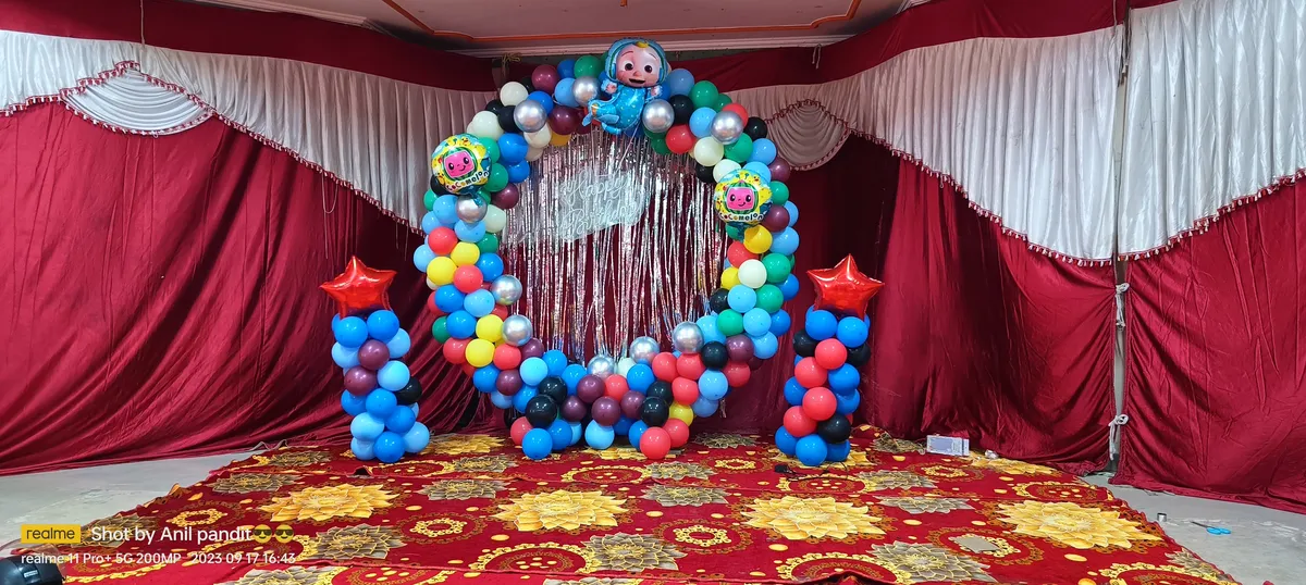 Balloon ring stage decoration for first birthday in banquet hall, Gurugram