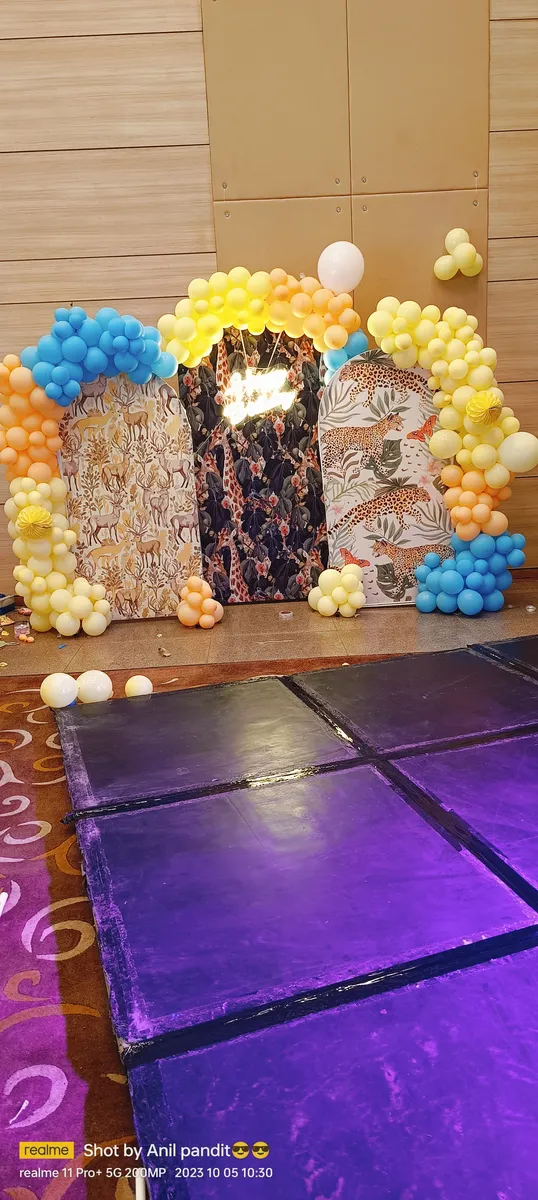 Blue and yellow balloon arch for kids birthday in banquet hall, Gurugram