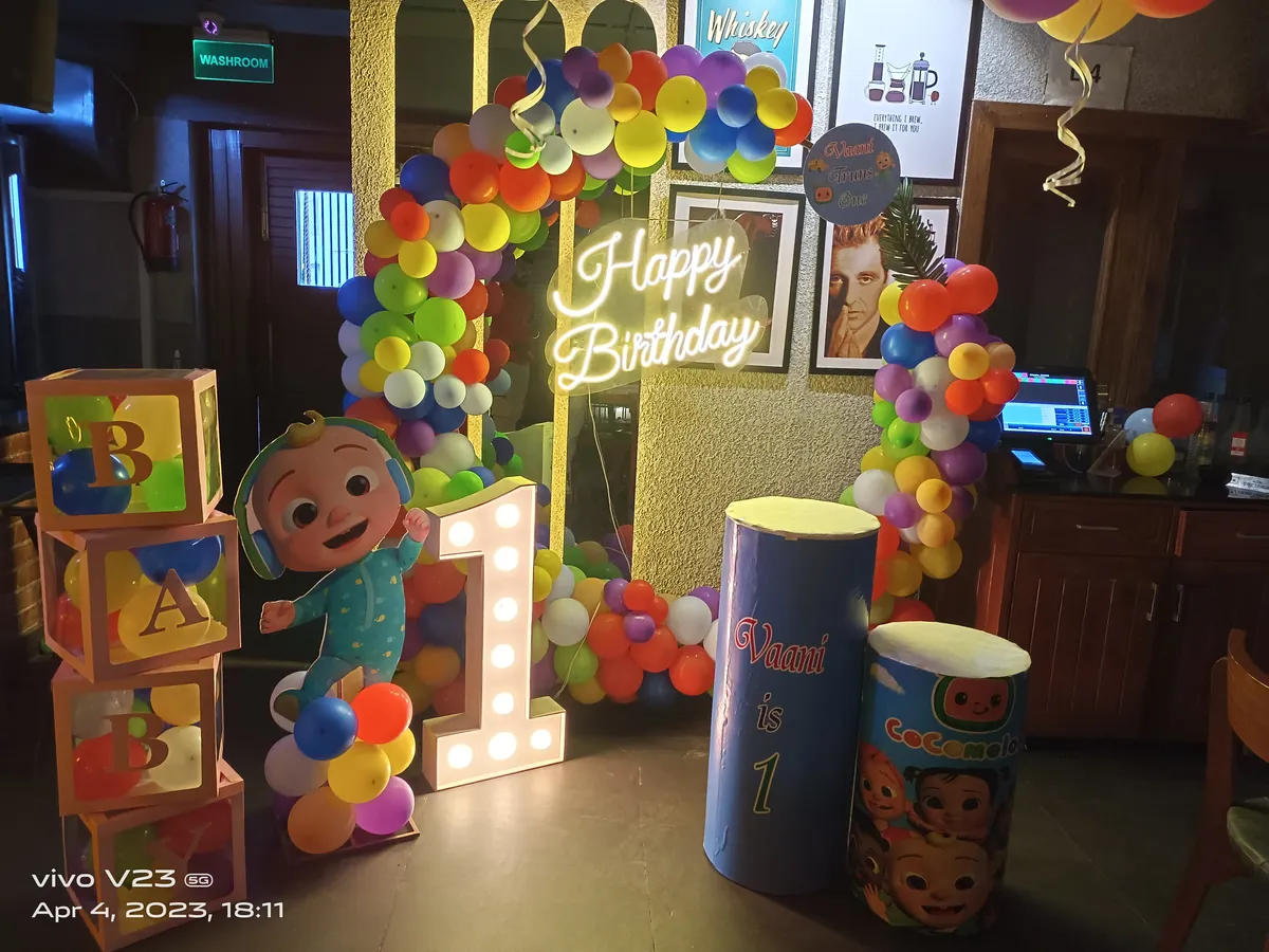 Cocomelon theme first birthday decoration with number light, Gurugram